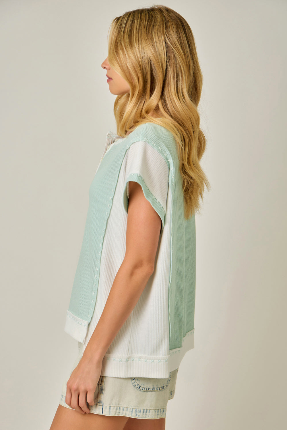 Thermal Color Block Tee with Button Trim Neckline & Cut-Out Hem Detail