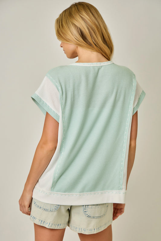 Thermal Color Block Tee with Button Trim Neckline & Cut-Out Hem Detail